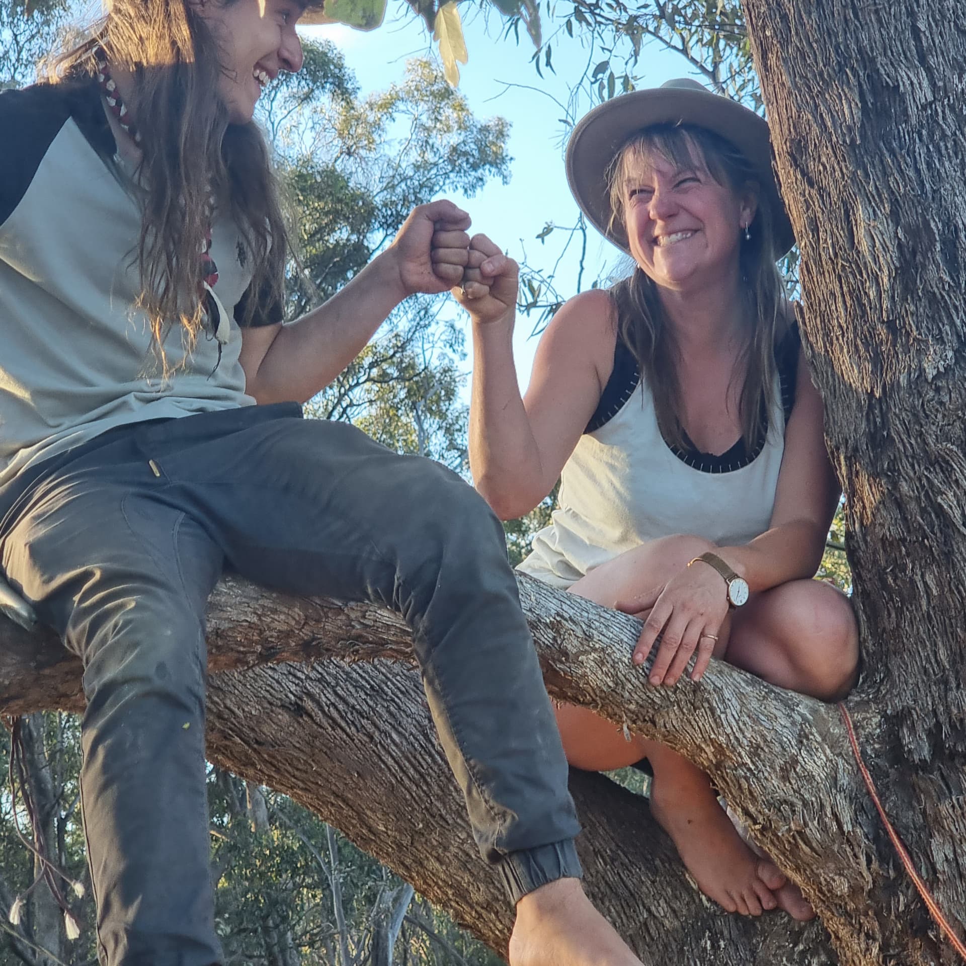 Nectar Connector and Cesar fist-bumping while sitting on a tree branch, Punk Caterpillar 2024