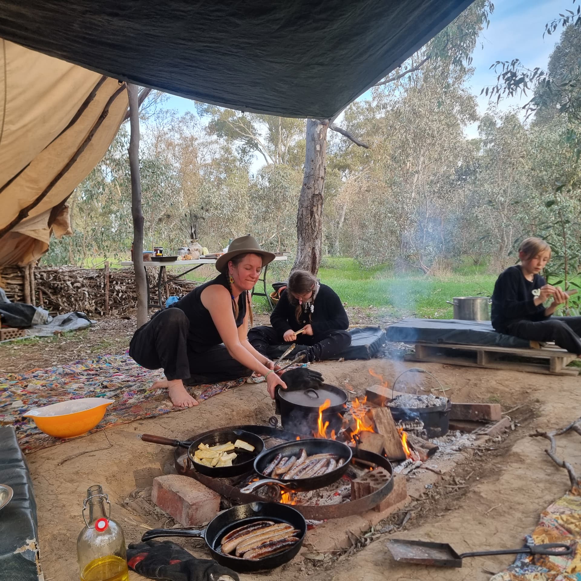 Cooking lunch over the campfire at a Punk Caterpillar gathering